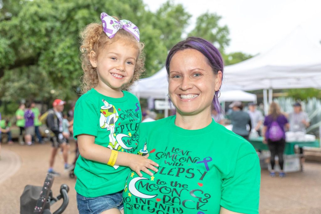 Family wearing a t-shirt that reads