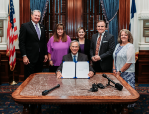 Sam's Law being signed into law at Governor Greg Abbott's desk.